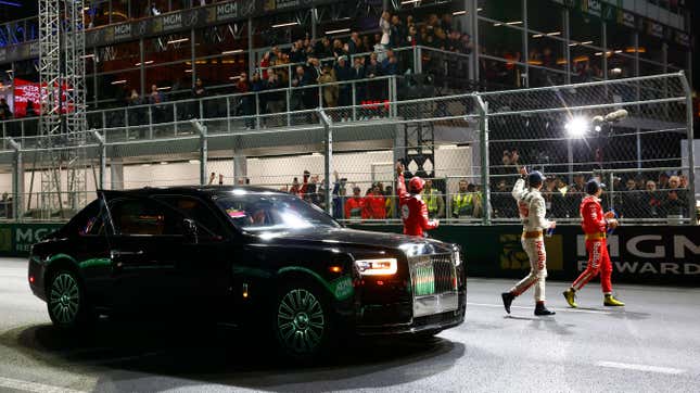 Ferrari driver Charles Leclerc (16) of Monaco, Red Bull Racing driver Max Verstappen (1) of the Netherlands, and Red Bull Racing driver Sergio Perez (11) of Mexico wave to fans as they arrive at the Bellagio Resort & Casino during the inaugural Formula 1 Heineken Silver Las Vegas Gran Prix on November 18, 2023 on the Las Vegas Street Circuit in Las Vegas, Nevada.