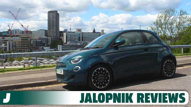 A photo of a dark blue Fiat 500 EV