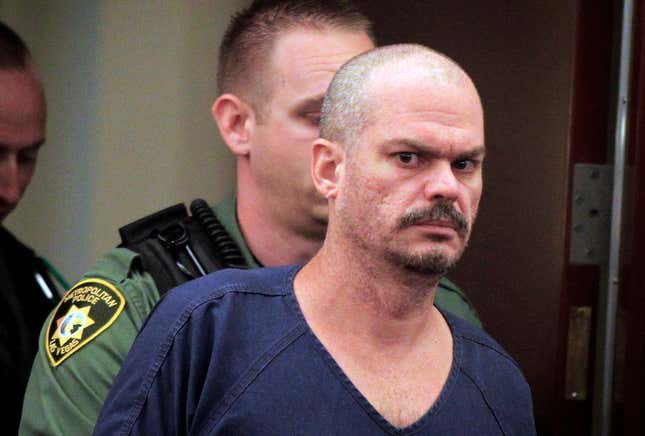 David Allen Brutsche, right, who identifies himself as a “sovereign citizen,” appears in Las Vegas Justice Court at the Regional Justice Center in Las Vegas. Brutsche, an ex-convict who pleaded guilty to conspiring to kidnap random Las Vegas police officers told a Nevada judge Wednesday Feb. 12, 2014, that he no longer adheres to the anti-government philosophy that prosecutors say spurred the plot.