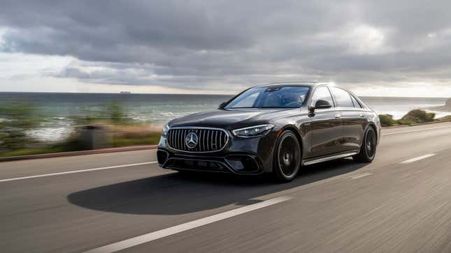 A dark gray 2024 Mercedes-AMG S63 E Performance drives on the California coast